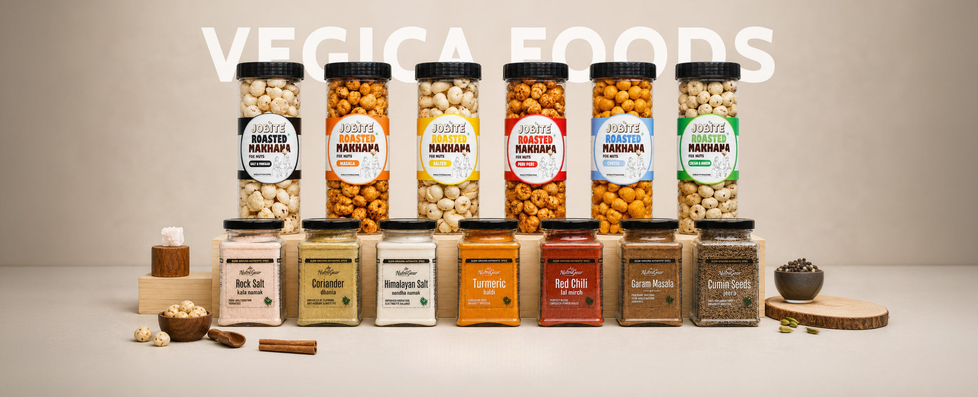 Display of various jars and boxes from Vegica Foods on a neutral background